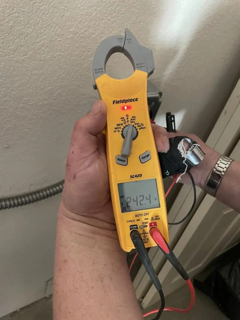 Voltage testing with clamp meter during Whole House Surge Protector in Leesburg
